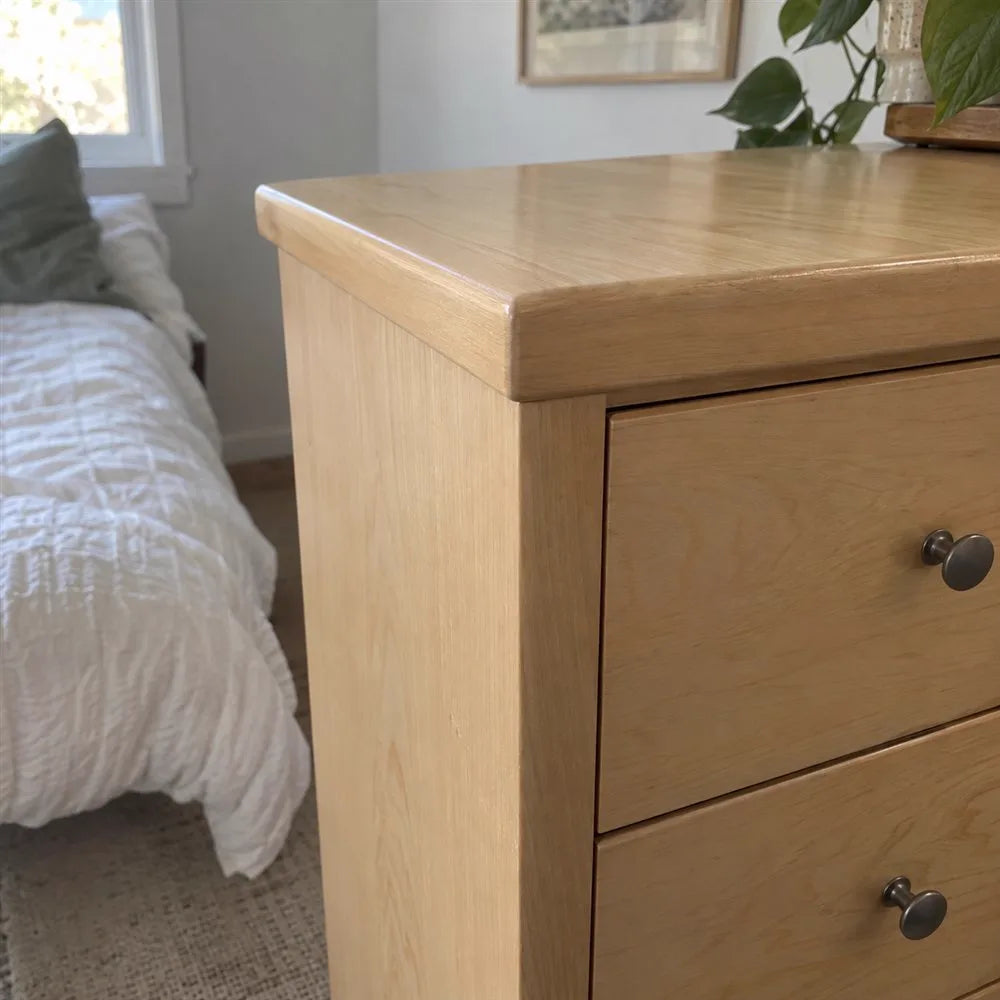 Repaired light wood dresser